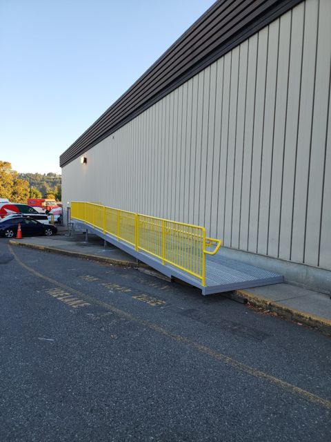 Steel ramp installed along the building, before final approach and wall opening