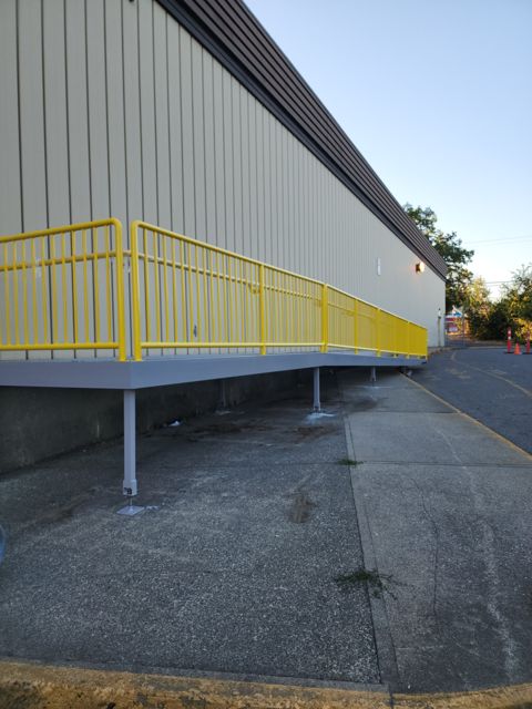 Ramp support legs anchored to the existing sidewalk
