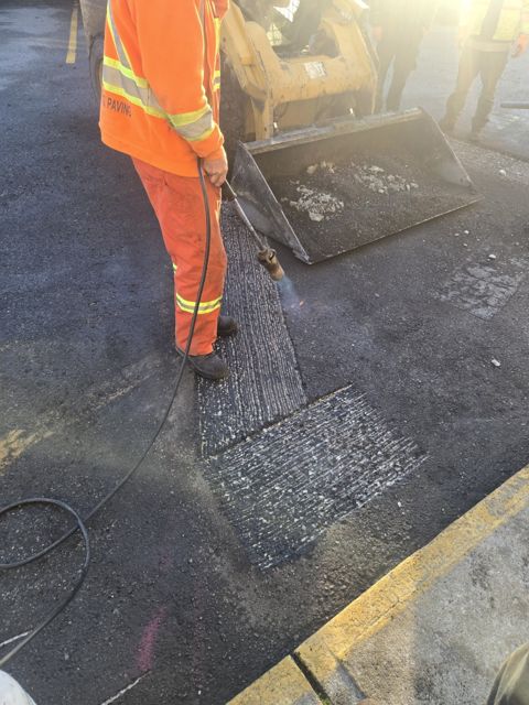 Preparing the existing asphalt for the new ramp transition