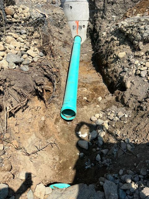 New PVC pipe laid in trench