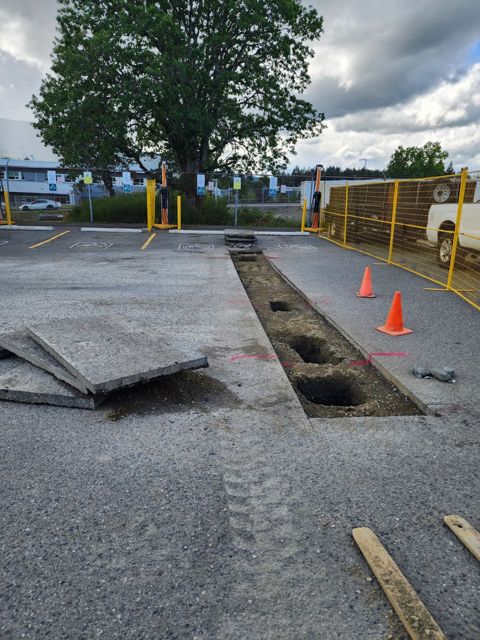 Pavement saw-cut and removed for drainage tie-ins